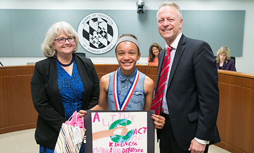 Isabella Farro standing with Board Chairman Cynthia Vaillancourt and Dr. Michael J. Martirano