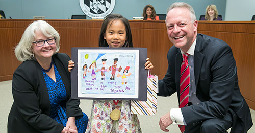 Sophia Hwu standing with Board Chairman Cynthia Vaillancourt and Dr. Michael J. Martirano