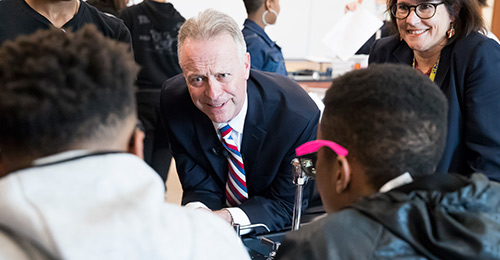 Dr. Martirano talking with students