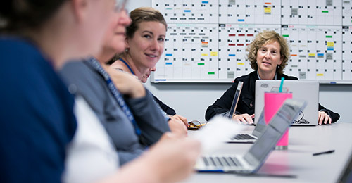 Nicole Meshbesher in a meeting with staff.