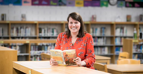 Lora Koehler reading a book