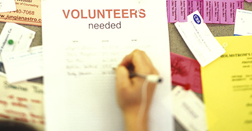 Volunteers needed sign.