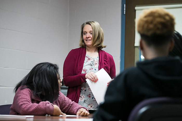 Principal Chrobak talking with Oakland Mills Middle School inside the classroom.