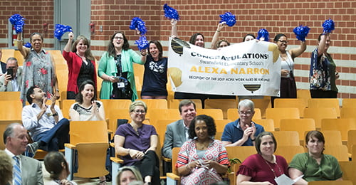 Group in an auditorium celebrates outstanding HCPSS alumni and staff.