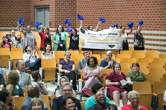 Group in an auditorium celebrates outstanding HCPSS alumni and staff.