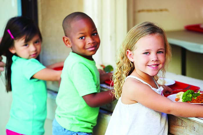 Young children in the lunch line.