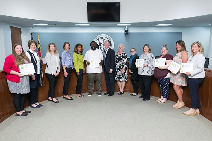 Superintendent Martirano, HCPSS Board members and several HCPSS staff hold certificates.