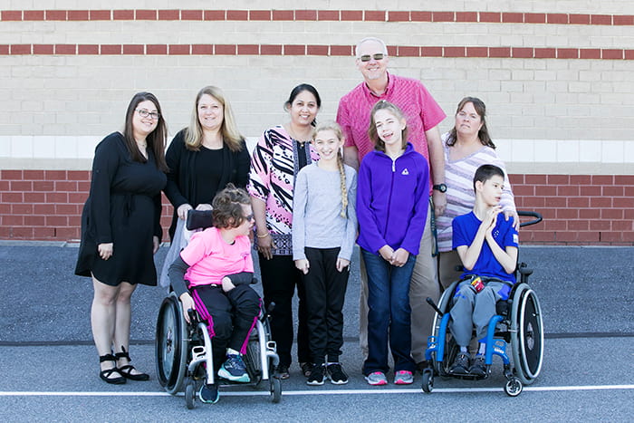 A group of students and teachers involved in Falcon Lunch Buddies at FQMS.