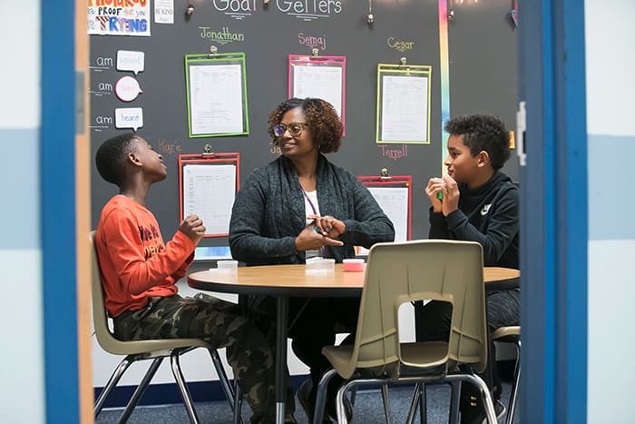 Clara Hendrick working with students.