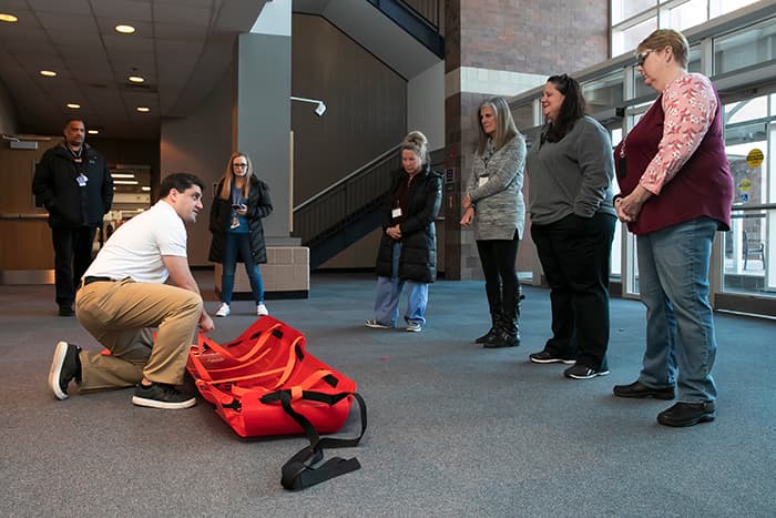 Teachers learning how to use a med sled.