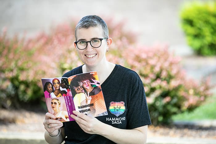 Danielle DuPuis holding a book.