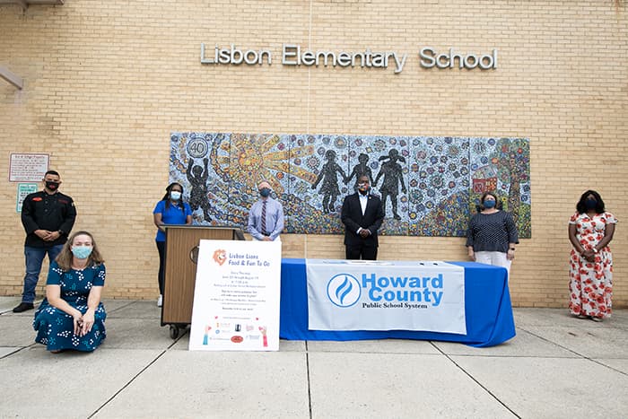 Volunteers standing outside of Lisbon Elementary School.