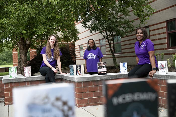 Three female Long Reach employees.