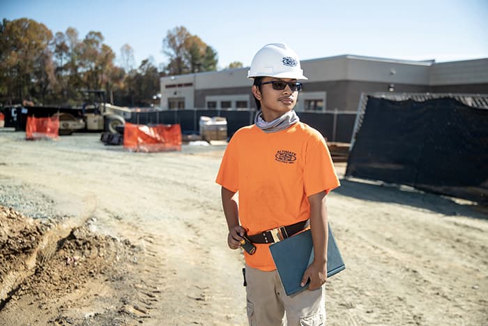 Christopher Borja stands at Hammond High School construction site.