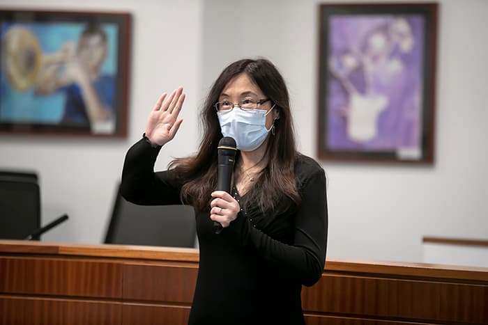 Dr. Yun Lu being sworn in.