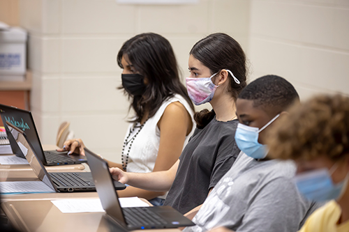 RHS students at computers and wearing masks