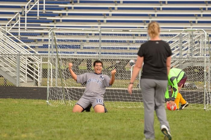 Zach McKay playing soccer.