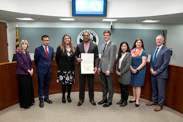 Board of Education members and the Superintendent recognize Okinawa Karate Dojo as a Friends of Education Award nominee.