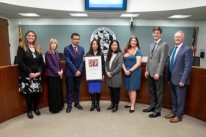 Board of Education members and the Superintendent present Ying Matties with the Friends of Education award.