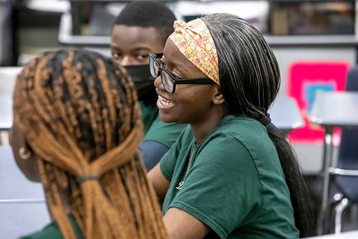 Female WLHS students speaks at a Rise Up meeting.