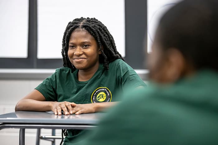 Emmanuella Osei meets with fellow Rise Up members at WLHS.