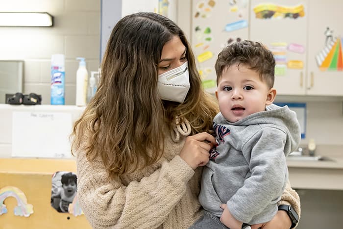 WLHS student holds her son.