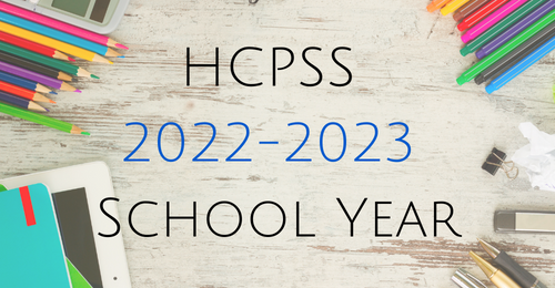 graphic of school supplies on a table. Text overlay stating, HCPSS 2022-2023 school year