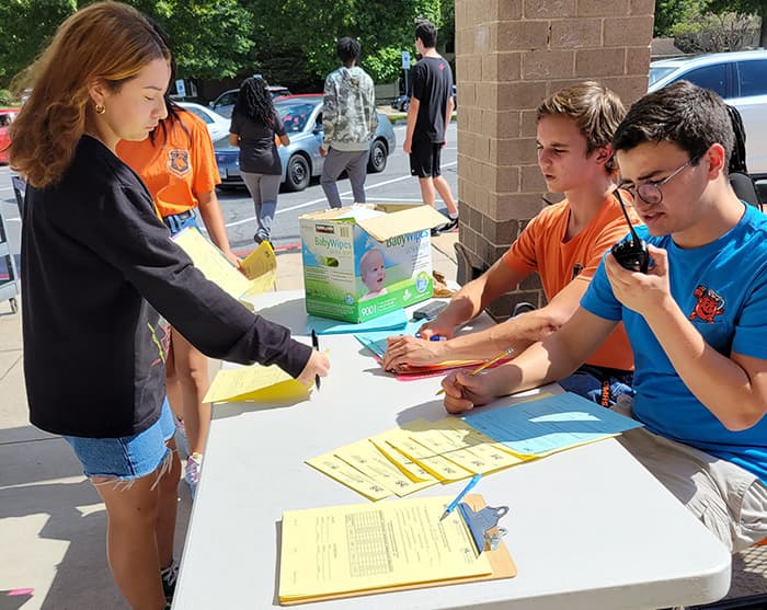 OMHS students processing order forms at the OMHS food pantry