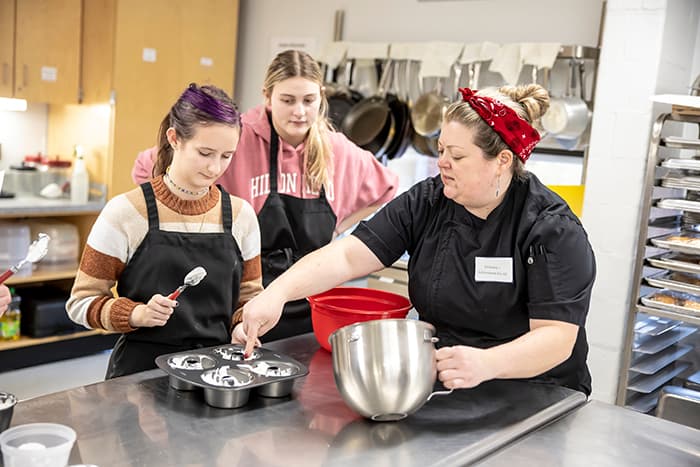 GHS students baking in the culinary science academy.