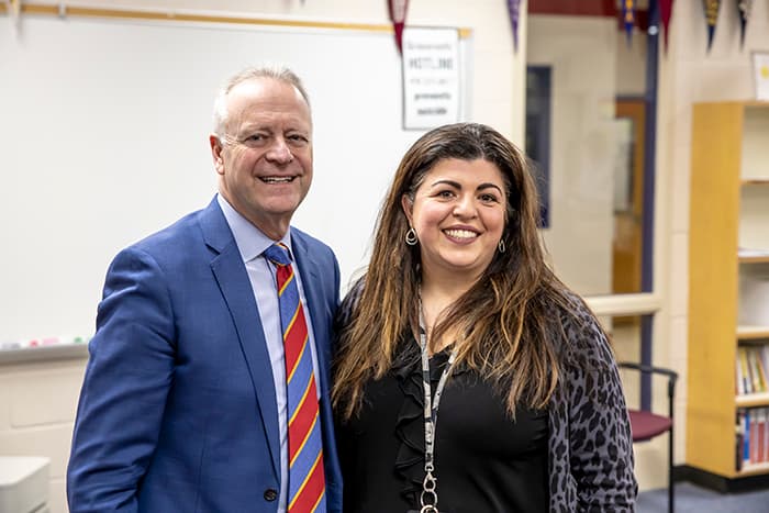 Superintendent Michael Martirano shakes Irene Khaksari's hand and congratulates her.