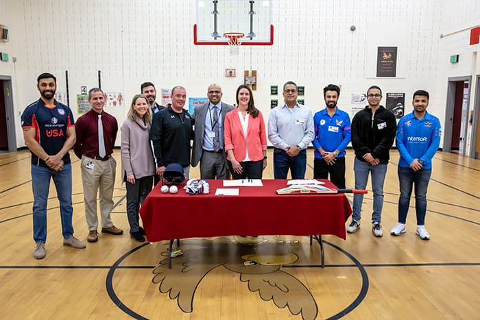 Columbia Cricket & Sports Complex representatives and HCPSS staff formalize a new partnership.