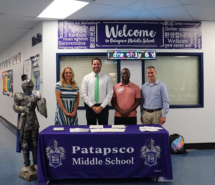 Patapsco Middle School and HCPSS staff sign a new partnership agreement.