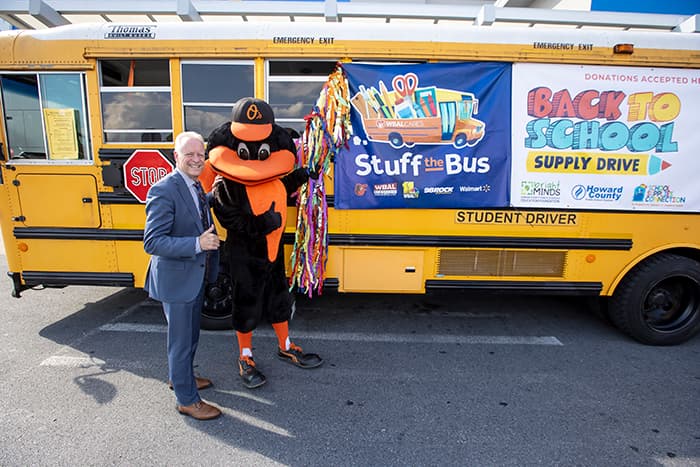 Dr. Martirano and the Orioles mascot at the 2023 Stuff the Bus event.