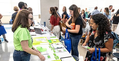 Individuals at a networking fair.