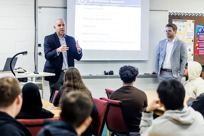 FBI agents speak to students in the Early College Cybersecurity Program.