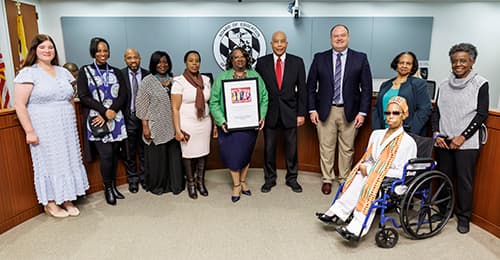 Board of Education members, HCPSS Superintendent William Barnes, and representatives from the African American Community Roundtable of Howard County.