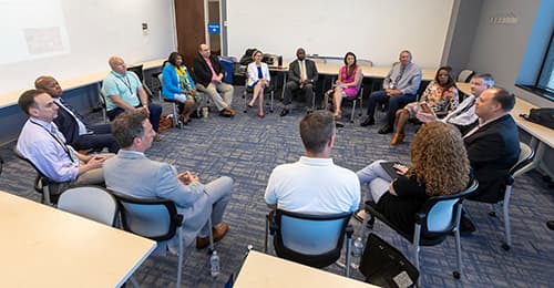 Superintendent's Leadership Academy participants sitting in a circle.