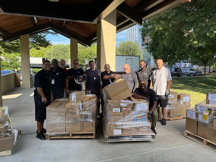 HCPSS Logistics Staff with boxes of supplies to deliver on behalf of Prepare for Success.