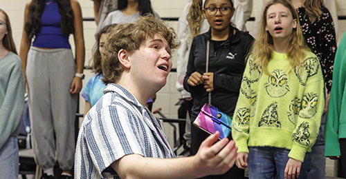 Ryan Schwab conducting LKMS chorus students.