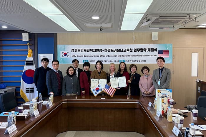 Jen Robinson, Min Woo, and representatives from the Gimpo District of Education for an MOU signing.