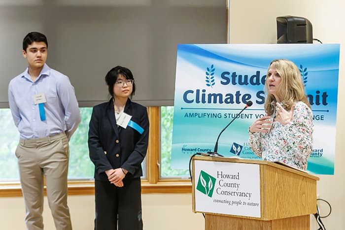 Meg Boyd and two HCPSS high school students at the Student Climate Summit.