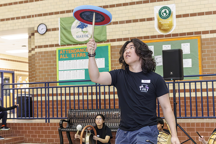 A student playing a game with a top.