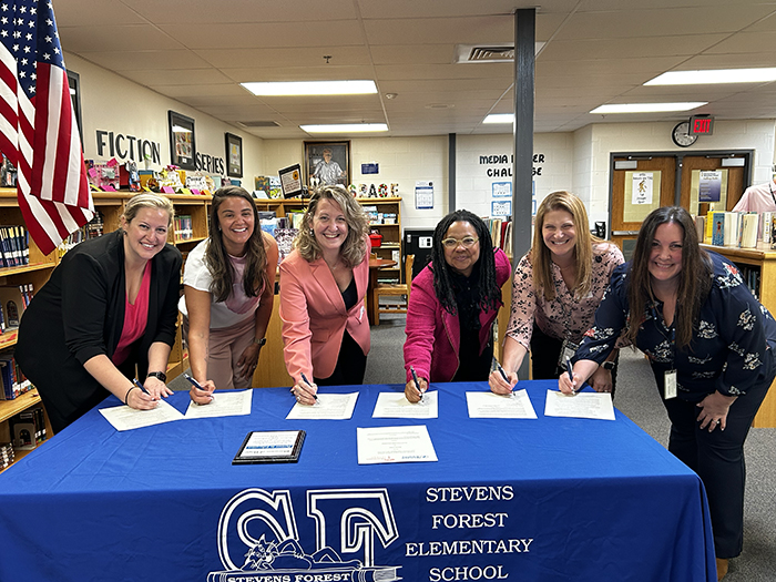 Partnership signing between HCPSS and Blossoms of Hope.