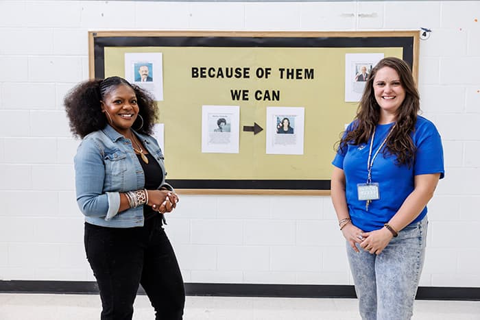 Tahesha Todd (L) and Mandy Gilliece (R) in front of one of the bulletin boards at LEMS decorated for Black History Month.