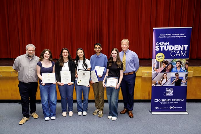 (L to R) Corey O’Brien, Katie Fishman, Alara Kocoglu, Angela Yang, Satvik Jain, Rachel Weintraub and David Riddler celebrate the winning videos during an assembly at CHS.